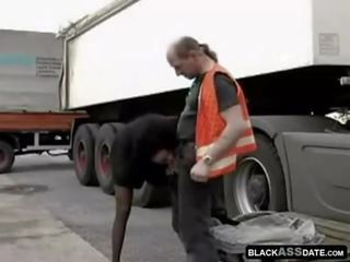Black street girl riding on marriageable truck driver outside